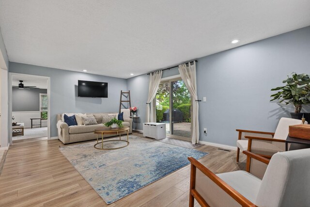 5210 Chevy Chase Ct, Columbus, OH 43220 - living area with light wood-type flooring, ceiling fan, baseboards, and recessed lighting