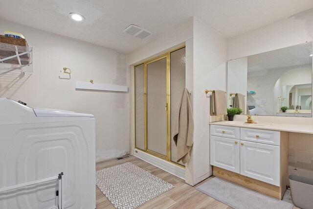5210 Chevy Chase Ct, Columbus, OH 43220 - full bath featuring washer / dryer, a shower stall, wood finished floors, vanity, and recessed lighting