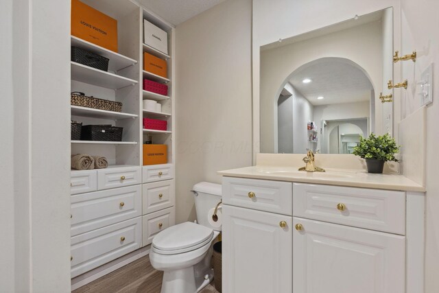 5210 Chevy Chase Ct, Columbus, OH 43220 - bathroom with vanity, toilet, and wood finished floors