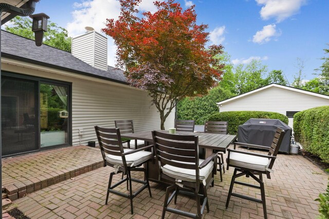 5210 Chevy Chase Ct, Columbus, OH 43220 - view of patio featuring a grill and outdoor dining space