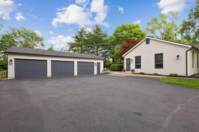 5210 Chevy Chase Ct, Columbus, OH 43220 - view of front of home featuring an outdoor structure and a garage