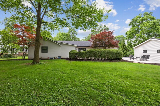 5210 Chevy Chase Ct, Columbus, OH 43220 - view of grassy yard with a patio
