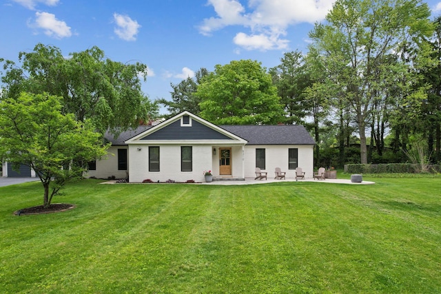 5210 Chevy Chase Ct, Columbus, OH 43220 - rear view of house with a yard, a patio, and roof with shingles