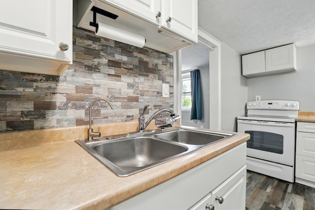 8301 Bennington Chapel Rd, Centerburg, OH 43011 - kitchen featuring electric stove, a sink, white cabinetry, light countertops, and backsplash