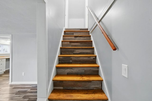 8301 Bennington Chapel Rd, Centerburg, OH 43011 - stairs featuring wood finished floors and baseboards
