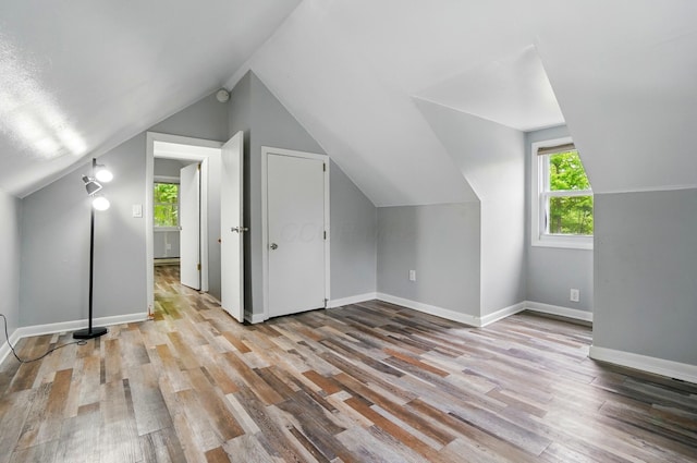 8301 Bennington Chapel Rd, Centerburg, OH 43011 - additional living space with wood finished floors, vaulted ceiling, and baseboards
