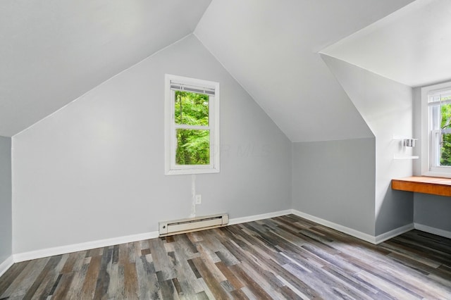 8301 Bennington Chapel Rd, Centerburg, OH 43011 - bonus room with a baseboard heating unit, wood finished floors, vaulted ceiling, and baseboards