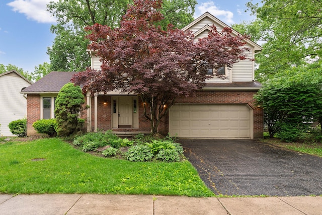 2321 Worthingwoods Blvd, Powell, OH 43065 - obstructed view of property featuring a garage, driveway, brick siding, and a front yard
