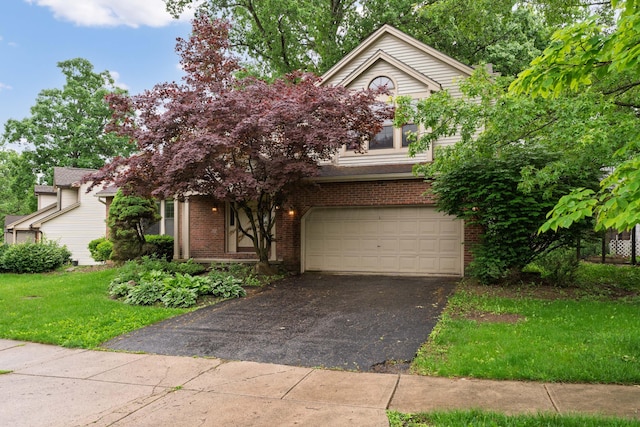2321 Worthingwoods Blvd, Powell, OH 43065 - obstructed view of property with driveway, an attached garage, brick siding, and a front lawn