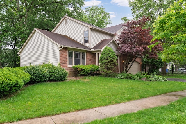 2321 Worthingwoods Blvd, Powell, OH 43065 - traditional-style house featuring brick siding, a garage, and roof with shingles
