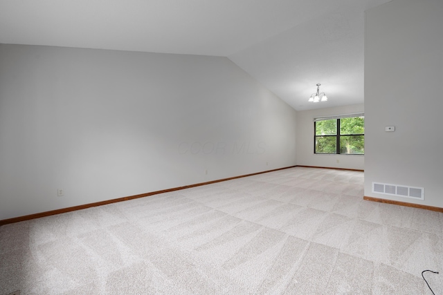 2321 Worthingwoods Blvd, Powell, OH 43065 - empty room with lofted ceiling, light colored carpet, a chandelier, and baseboards