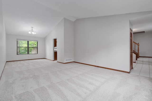 2321 Worthingwoods Blvd, Powell, OH 43065 - unfurnished room featuring light carpet, vaulted ceiling, a chandelier, baseboards, and stairway