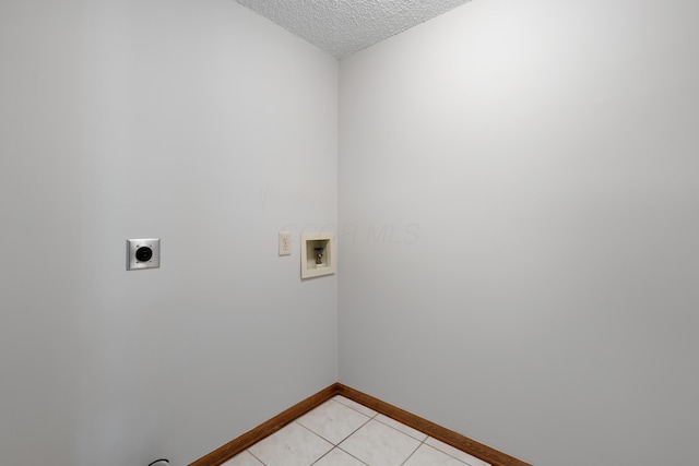 2321 Worthingwoods Blvd, Powell, OH 43065 - washroom with hookup for an electric dryer, washer hookup, a textured ceiling, baseboards, and light tile patterned floors