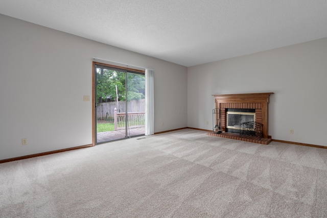 2321 Worthingwoods Blvd, Powell, OH 43065 - unfurnished living room featuring light colored carpet, a fireplace, baseboards, and a textured ceiling
