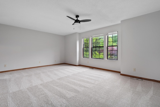 2321 Worthingwoods Blvd, Powell, OH 43065 - spare room with light carpet, ceiling fan, baseboards, and a textured ceiling