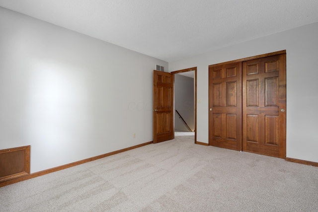 2321 Worthingwoods Blvd, Powell, OH 43065 - unfurnished bedroom with light carpet, baseboards, and a closet