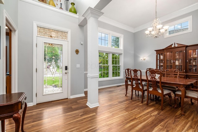 5552 Quail Hollow Way, Westerville, OH 43082 - dining room with ornate columns, a towering ceiling, a chandelier, healthy amount of natural light, and crown molding