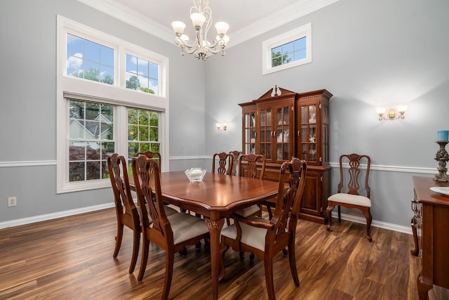 5552 Quail Hollow Way, Westerville, OH 43082 - dining room featuring a chandelier, ornamental molding, dark wood-type flooring, healthy amount of natural light, and baseboards