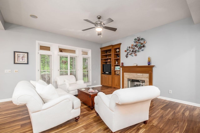 5552 Quail Hollow Way, Westerville, OH 43082 - living area with baseboards, a stone fireplace, wood finished floors, and a ceiling fan