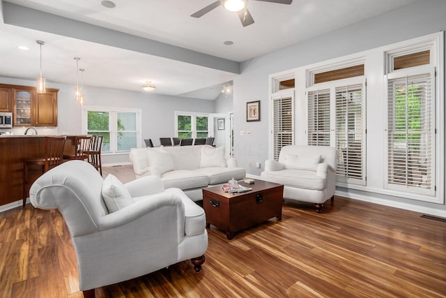 5552 Quail Hollow Way, Westerville, OH 43082 - living area with a ceiling fan, wood finished floors, and baseboards