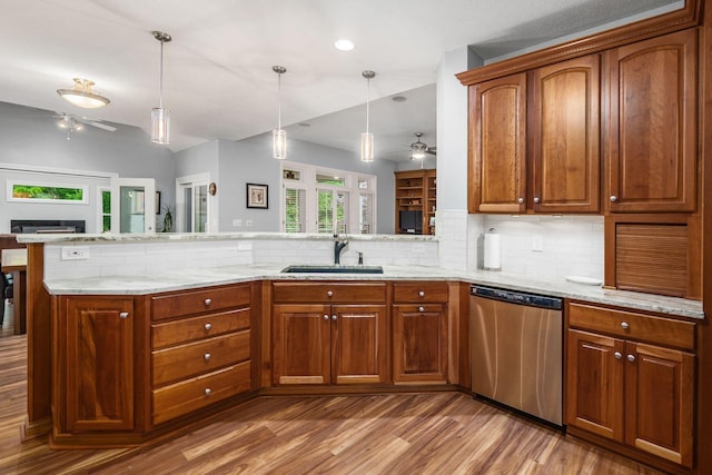 5552 Quail Hollow Way, Westerville, OH 43082 - kitchen with dishwasher, ceiling fan, a fireplace, light wood finished floors, and backsplash