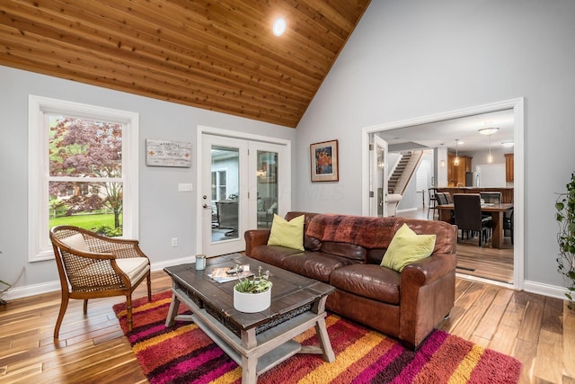 5552 Quail Hollow Way, Westerville, OH 43082 - living room with stairs, hardwood / wood-style flooring, high vaulted ceiling, and baseboards