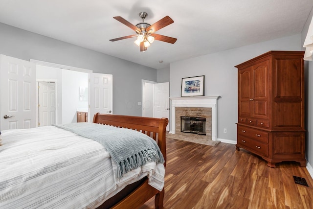 5552 Quail Hollow Way, Westerville, OH 43082 - bedroom with wood finished floors, a fireplace, baseboards, and a ceiling fan