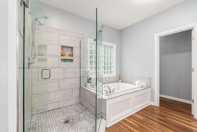 5552 Quail Hollow Way, Westerville, OH 43082 - full bathroom with a garden tub, a stall shower, wood finished floors, and baseboards