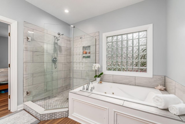 5552 Quail Hollow Way, Westerville, OH 43082 - full bathroom featuring a tub with jets, a stall shower, wood finished floors, and vaulted ceiling