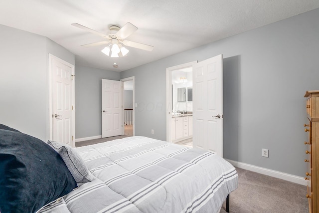 5552 Quail Hollow Way, Westerville, OH 43082 - bedroom with light colored carpet, baseboards, ceiling fan, and connected bathroom