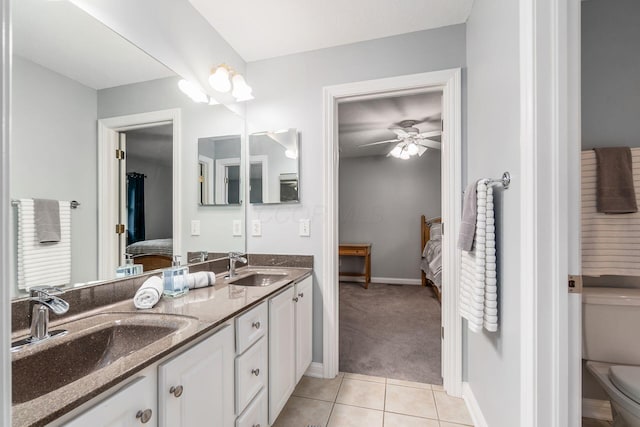 5552 Quail Hollow Way, Westerville, OH 43082 - ensuite bathroom with double vanity, tile patterned flooring, toilet, ceiling fan, and baseboards