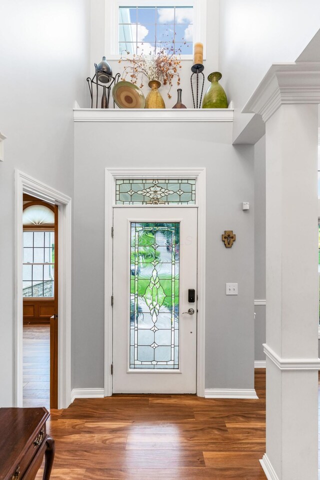 5552 Quail Hollow Way, Westerville, OH 43082 - foyer entrance with a high ceiling, wood finished floors, and baseboards