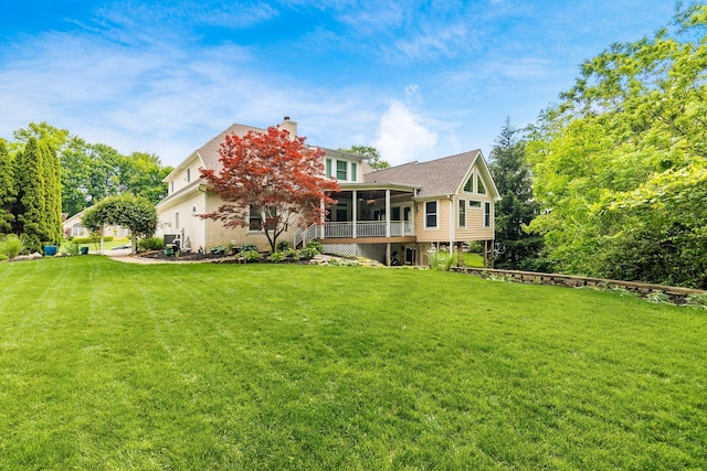 5552 Quail Hollow Way, Westerville, OH 43082 - rear view of house with a sunroom, a lawn, and a chimney