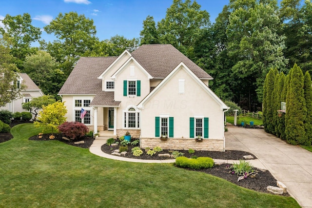 5552 Quail Hollow Way, Westerville, OH 43082 - traditional home featuring stone siding, stucco siding, a front lawn, and a shingled roof