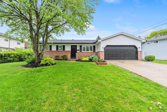 5148 Riverbirch Dr N, Columbus, OH 43229 - ranch-style home with brick siding, an attached garage, a front yard, and driveway