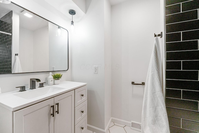 5148 Riverbirch Dr N, Columbus, OH 43229 - bathroom featuring vanity, baseboards, and tile patterned floors