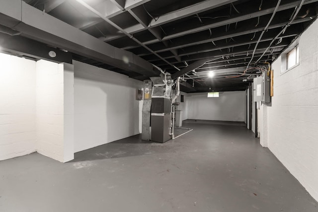 5148 Riverbirch Dr N, Columbus, OH 43229 - unfinished below grade area featuring heating unit and concrete block wall