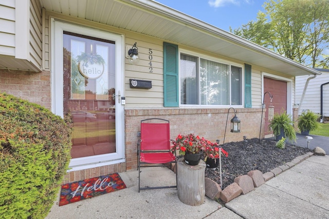 5042 Lindora Dr, Columbus, OH 43232 - doorway to property featuring brick siding