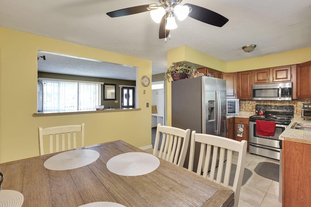 5042 Lindora Dr, Columbus, OH 43232 - dining room featuring ceiling fan and light tile patterned flooring