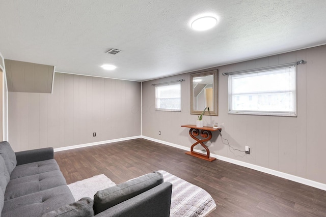 5042 Lindora Dr, Columbus, OH 43232 - living room featuring wood finished floors, baseboards, and a textured ceiling