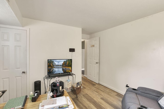 5042 Lindora Dr, Columbus, OH 43232 - living room featuring wood finished floors and baseboards