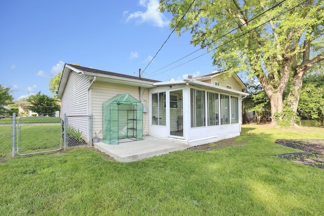 5042 Lindora Dr, Columbus, OH 43232 - back of property featuring a sunroom, a gate, and a patio