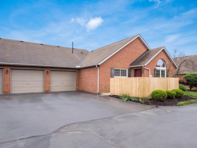 2594 Roberts Ct, Hilliard, OH 43026 - view of front facade featuring brick siding, driveway, a garage, and a shingled roof