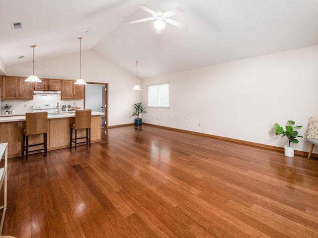 2594 Roberts Ct, Hilliard, OH 43026 - unfurnished living room with dark wood-type flooring, ceiling fan, high vaulted ceiling, and baseboards