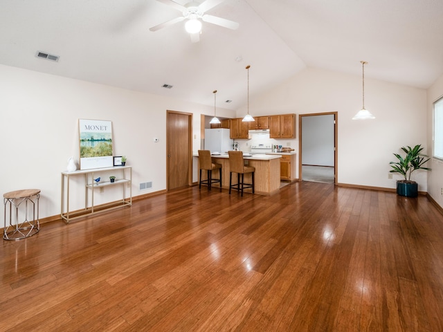 2594 Roberts Ct, Hilliard, OH 43026 - living room with dark wood-type flooring, ceiling fan, plenty of natural light, baseboards, and high vaulted ceiling