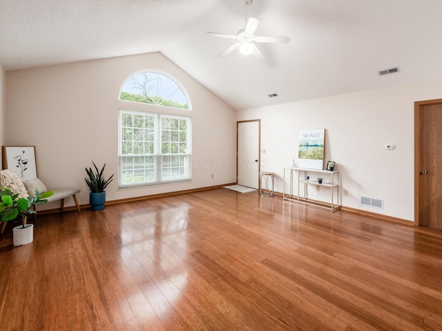 2594 Roberts Ct, Hilliard, OH 43026 - unfurnished living room featuring ceiling fan, vaulted ceiling, wood finished floors, and baseboards