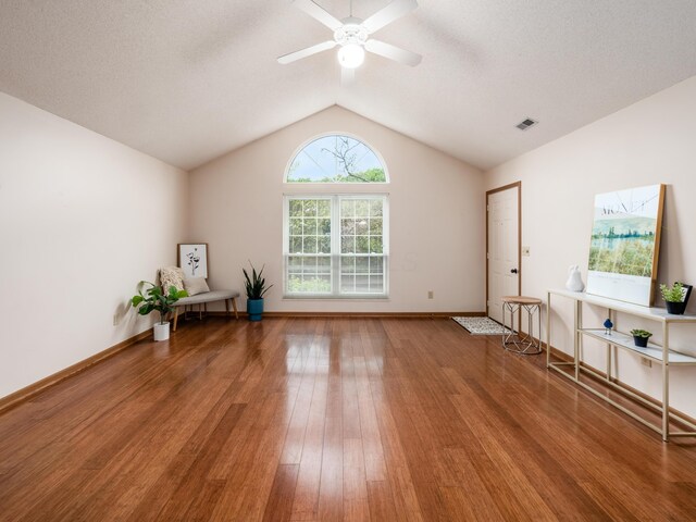 2594 Roberts Ct, Hilliard, OH 43026 - empty room featuring wood finished floors, vaulted ceiling, a ceiling fan, and baseboards