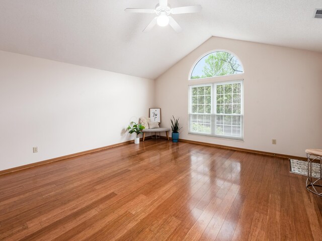 2594 Roberts Ct, Hilliard, OH 43026 - empty room with lofted ceiling, wood finished floors, ceiling fan, and baseboards