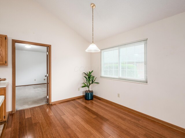 2594 Roberts Ct, Hilliard, OH 43026 - unfurnished room featuring wood finished floors, vaulted ceiling, and baseboards