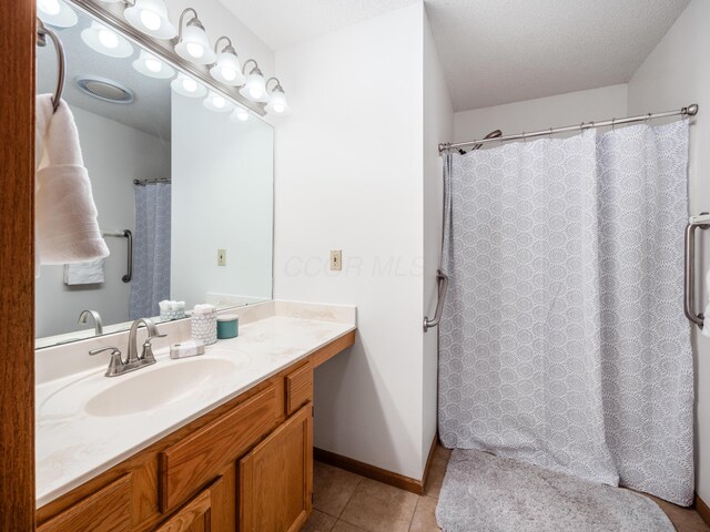 2594 Roberts Ct, Hilliard, OH 43026 - bathroom with tile patterned floors, vanity, a shower with curtain, and baseboards